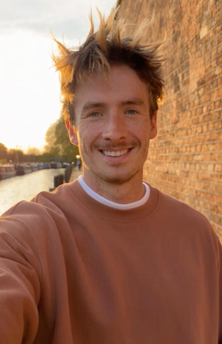 Callum Hayes by a canal at sunset